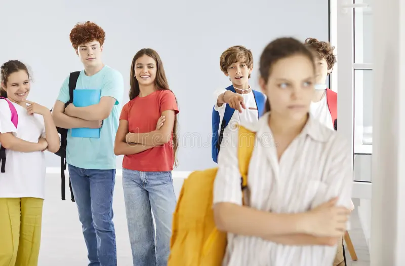 outcast-teenager-girl-suffering-bullying-school-group-classmates-laughing-behind-sad-female-standing-alone-her-331936089